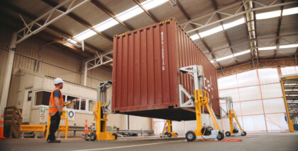 Bison A Series jacks lifting a shipping container