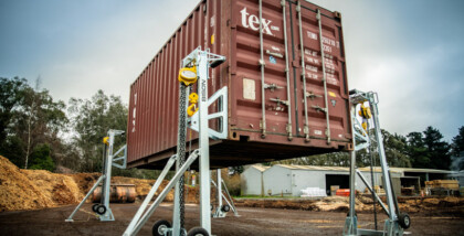 manual lifting jacks raising a 20ft container