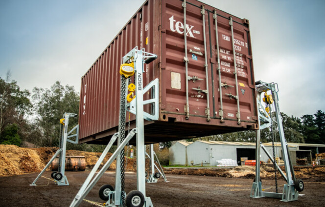 manual lifting jacks raising a 20ft container
