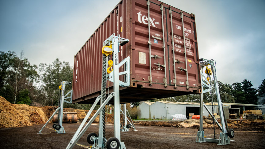 manual lifting jacks raising a 20ft container